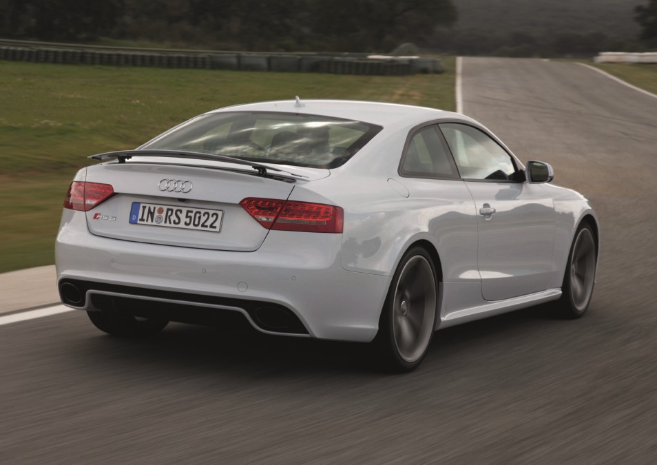Audi RS5 V8 performing a high-speed cornering maneuver on track