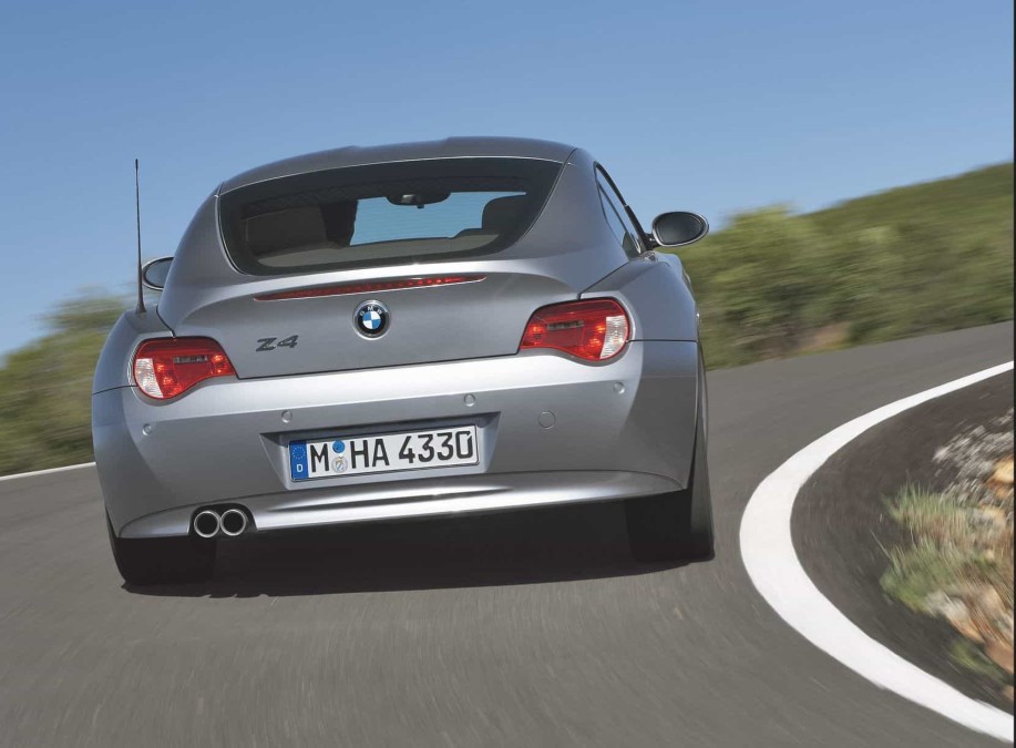 Dynamic rear view of the BMW Z4 3.0 Si Coupe in motion