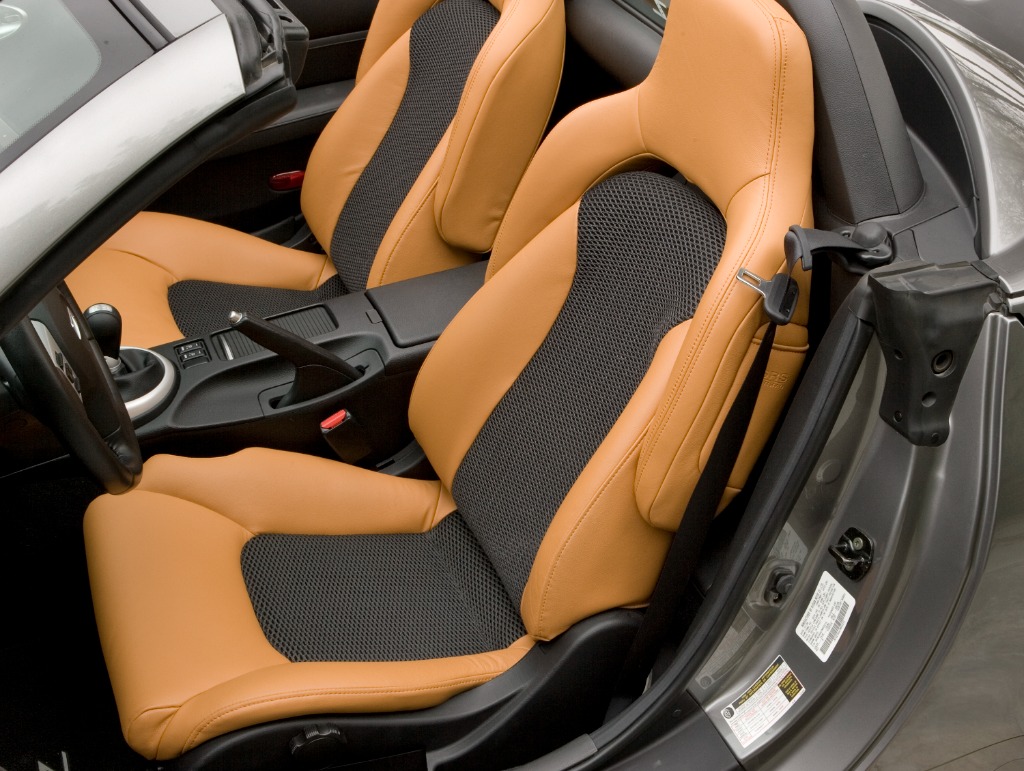 Nissan 350Z Roadster sport seats in perforated burnt-orange Alezan leather providing comfort and lateral support