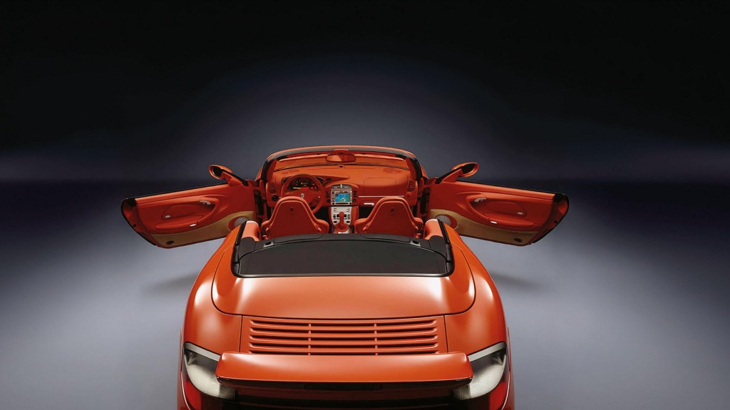 Top-down view of the full extended leather interior of the Porsche 996 Turbo with doors open